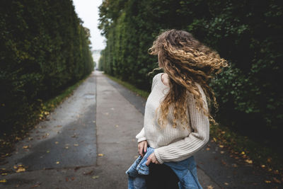 Woman walking on road