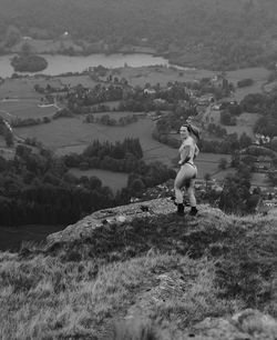 Rear view of man standing on field