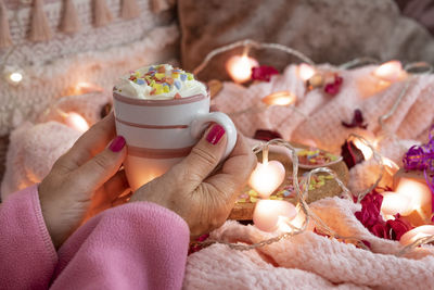 Close-up of hand holding ice cream