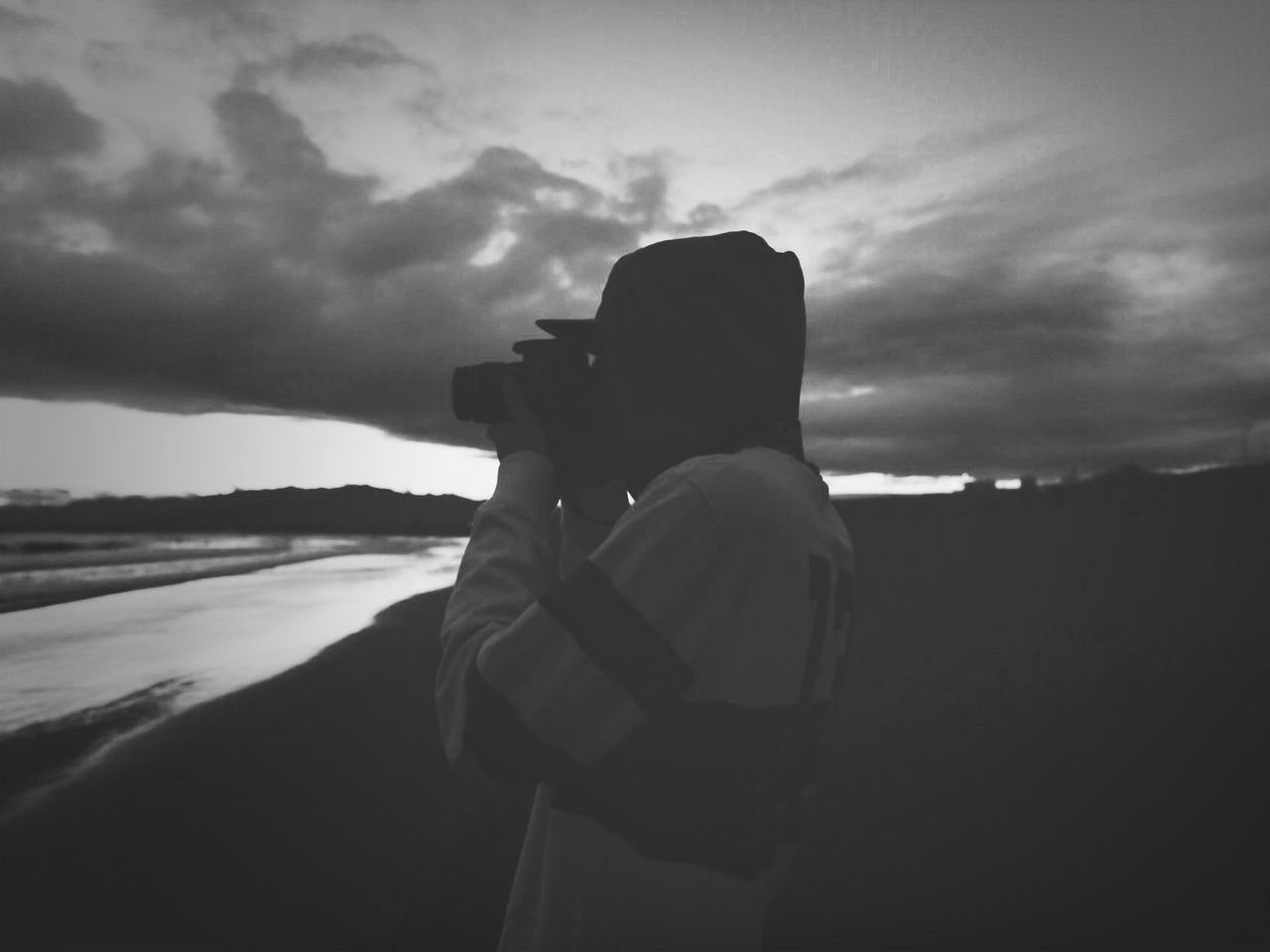 sky, cloud - sky, silhouette, cloudy, cloud, rear view, men, lifestyles, leisure activity, dusk, sunset, weather, tranquility, nature, outdoors, standing, tranquil scene, overcast