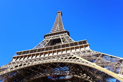 Low angle view of tower against blue sky