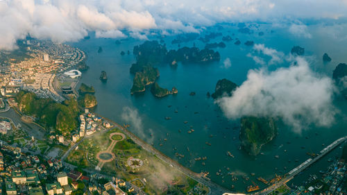 High angle view of land and sea against sky