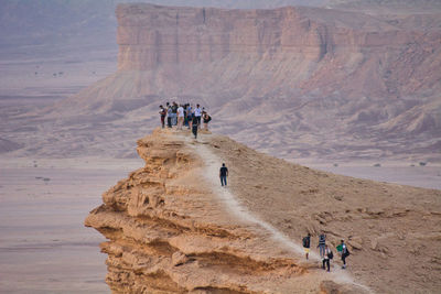 People on rock formations