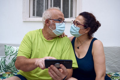 Midsection of woman using mobile phone