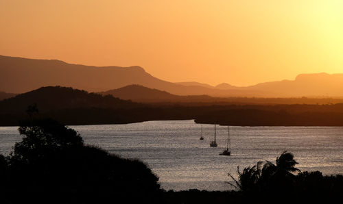 Scenic view of sea against orange sky