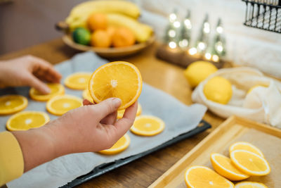 How to dry orange slices for eco friendly zero waste holiday decor. close up process of drying