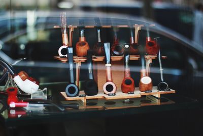 Close-up of smoking pipes on table