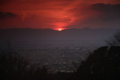 Silhouette of mountain against sky at sunset