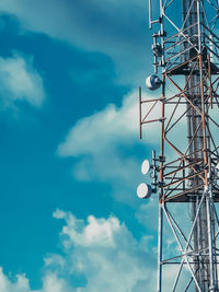 Low angle view of communications tower against sky