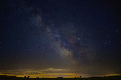 Scenic view of star field against sky at night