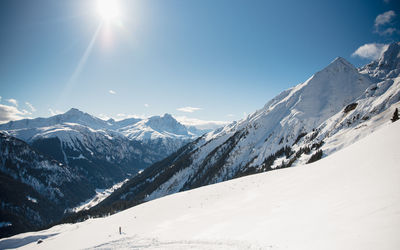 Scenic view of snowcapped mountains against sky