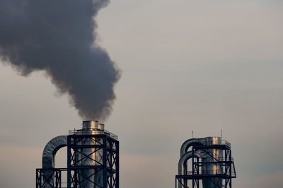 Air pollution from factory. black smoke from chimney of industrial pipe. global warming problem 