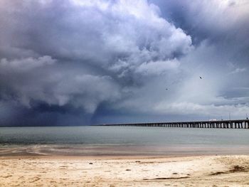 Scenic view of sea against cloudy sky