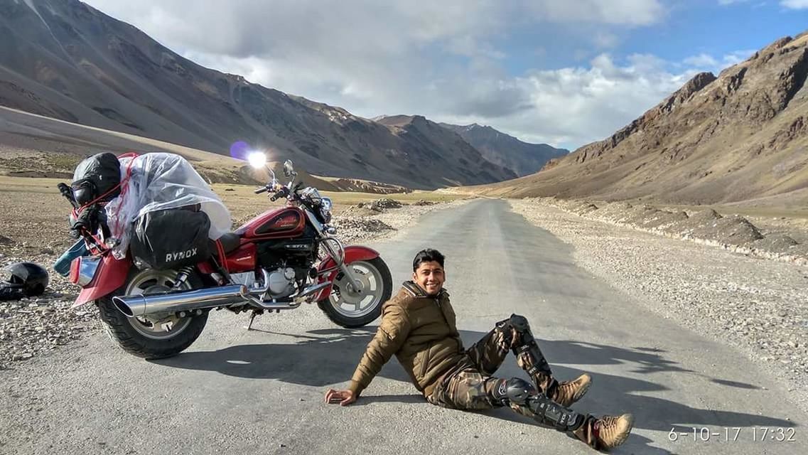 MAN RIDING BICYCLE ON ROAD