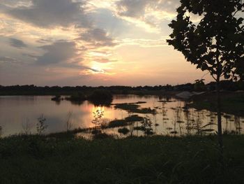 Scenic view of lake against sky during sunset