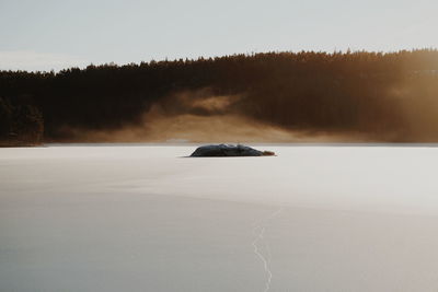 Scenic view of frozen lake against sky