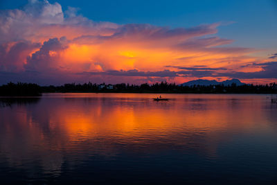Idyllic shot of lake against sky during sunset