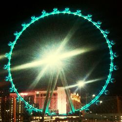 Low angle view of illuminated ferris wheel