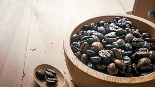 High angle view of coffee beans in bowl on table