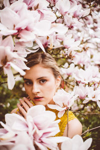 Portrait of woman with pink flowers