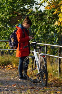 Rear view of man riding bicycle
