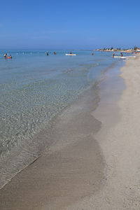 Scenic view of beach against clear sky