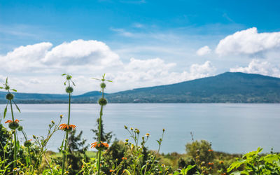 Scenic view of lake with mountains in background