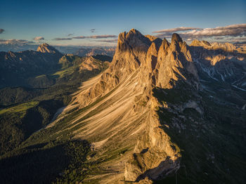 Last sunrays at the geisler peaks - scenic view of dramatic landscape against sky
