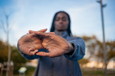 Man holding woman standing against blurred background