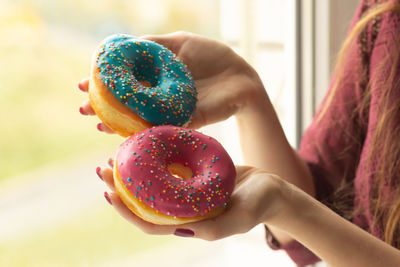 Close-up of hand holding ice cream