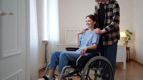 Young couple sitting at home