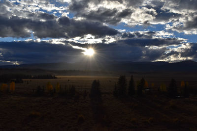 Scenic view of landscape against sky during sunset