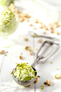 Close-up of ice cream in serving scoop on table