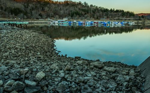 Scenic view of river against blue sky