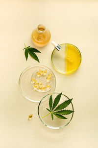 Products with cbd oil in laboratory glassware, concept of medical cannabidiol