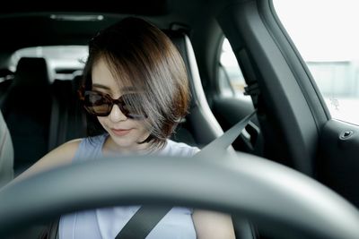 Portrait of woman in car