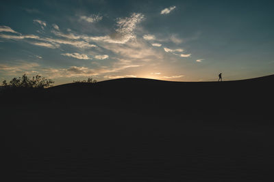 Scenic view of silhouette landscape against sky during sunset