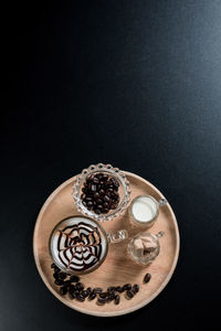 High angle view of coffee on table against black background