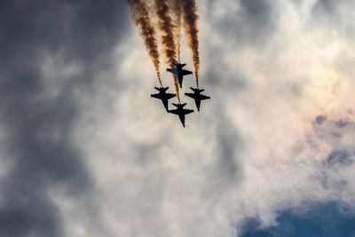 Low angle view of airplane against sky