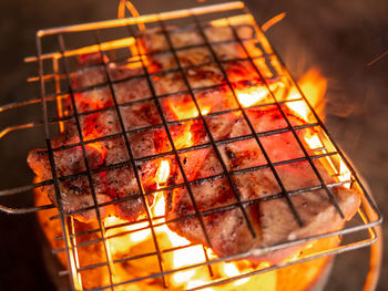 Close-up of meat on barbecue grill