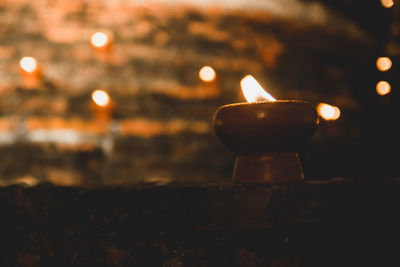 Close-up of illuminated lamp against blurred background