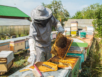 Rear view of man working at farm