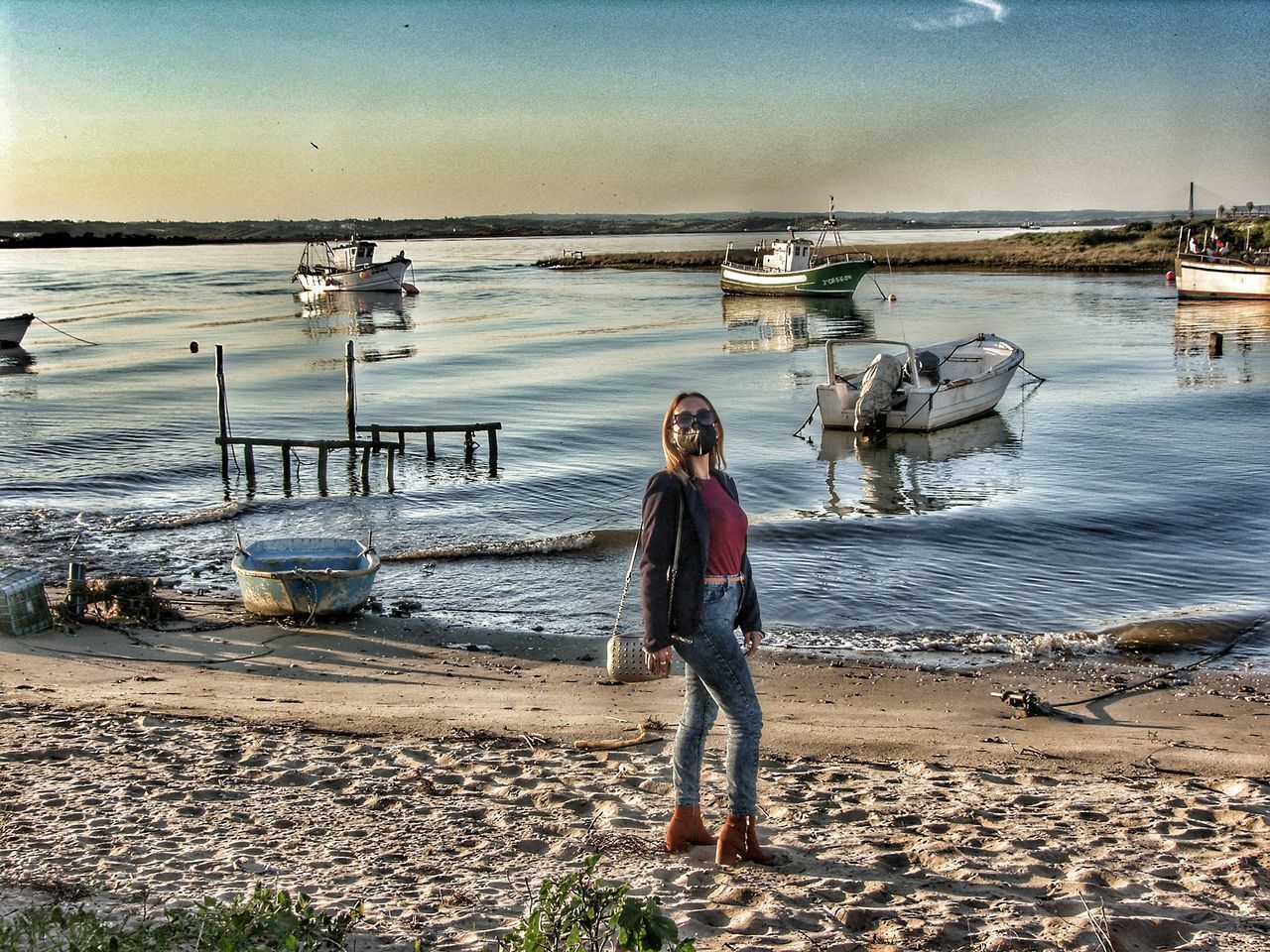 WOMAN STANDING AT BEACH