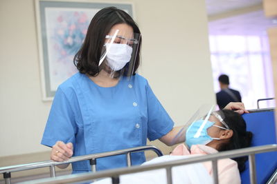 Doctor examining patient in hospital