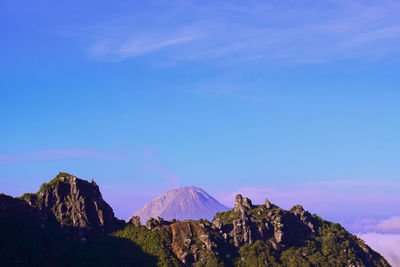 View of mountain  sinabung erruption range against cloudy sky