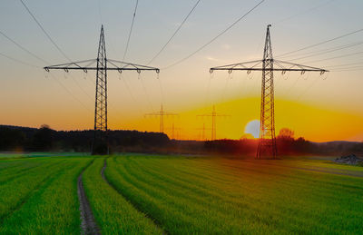 Scenic view of field against sky during sunset