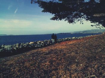 Scenic view of sea against cloudy sky