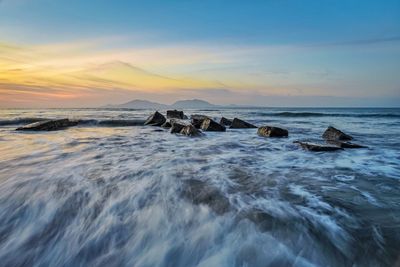 Scenic view of sea against sky during sunset