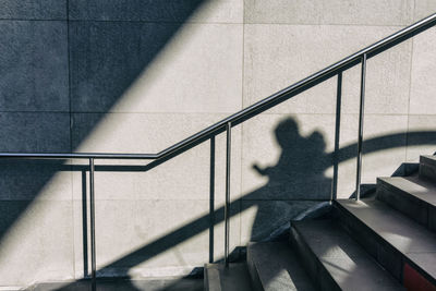 Shadow of people on staircase