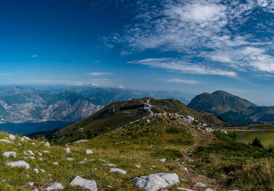 Scenic view of mountains against blue sky